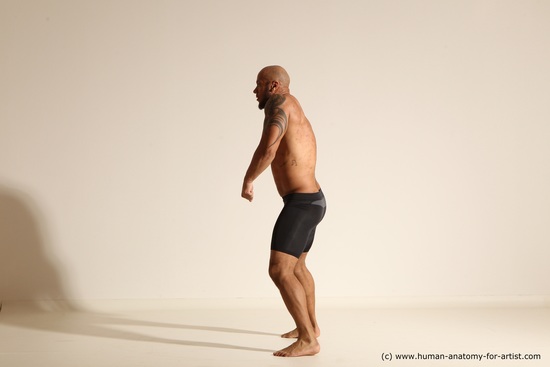 Underwear Gymnastic poses Man Black Muscular Bald Dancing Dynamic poses Academic