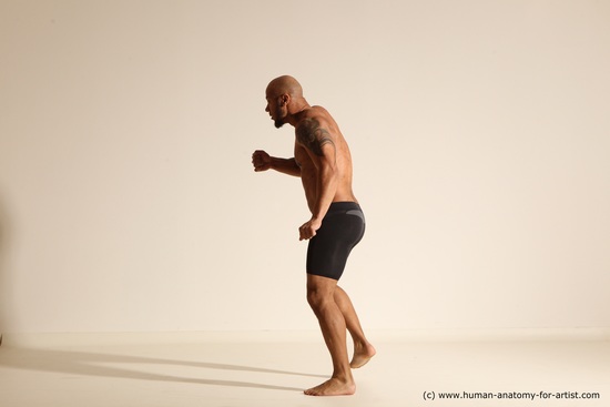 Underwear Gymnastic poses Man Black Muscular Bald Dancing Dynamic poses Academic