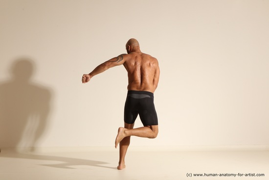 Underwear Gymnastic poses Man Black Muscular Bald Dancing Dynamic poses Academic