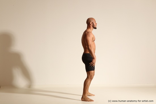 Underwear Gymnastic poses Man Black Muscular Bald Dancing Dynamic poses Academic