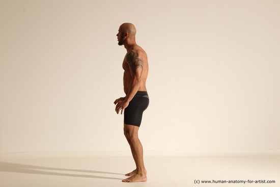 Underwear Gymnastic poses Man Black Muscular Bald Dancing Dynamic poses Academic