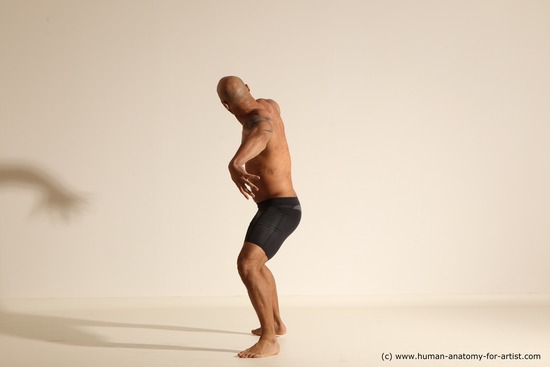 Underwear Gymnastic poses Man Black Muscular Bald Dancing Dynamic poses Academic