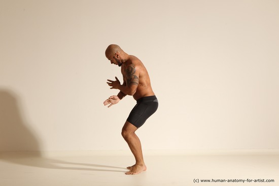 Underwear Gymnastic poses Man Black Muscular Bald Dancing Dynamic poses Academic