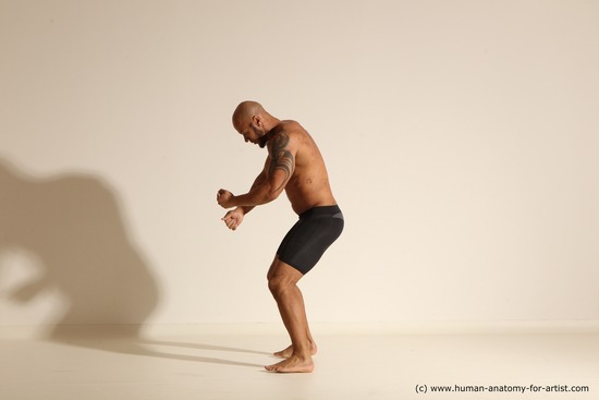 Underwear Gymnastic poses Man Black Muscular Bald Dancing Dynamic poses Academic