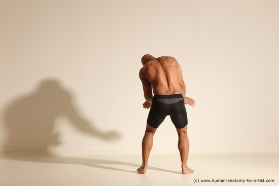 Underwear Gymnastic poses Man Black Muscular Bald Dancing Dynamic poses Academic