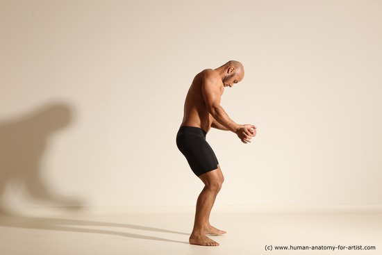 Underwear Gymnastic poses Man Black Muscular Bald Dancing Dynamic poses Academic