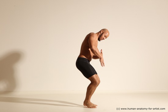 Underwear Gymnastic poses Man Black Muscular Bald Dancing Dynamic poses Academic