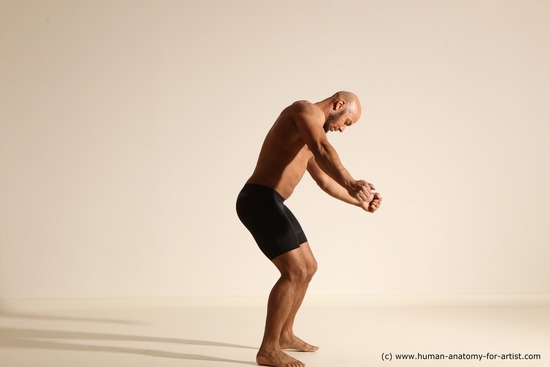 Underwear Gymnastic poses Man Black Muscular Bald Dancing Dynamic poses Academic