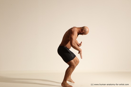 Underwear Gymnastic poses Man Black Muscular Bald Dancing Dynamic poses Academic