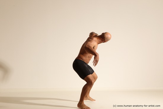 Underwear Gymnastic poses Man Black Muscular Bald Dancing Dynamic poses Academic