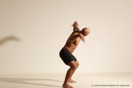 Underwear Gymnastic poses Man Black Muscular Bald Dancing Dynamic poses Academic