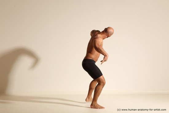 Underwear Gymnastic poses Man Black Muscular Bald Dancing Dynamic poses Academic