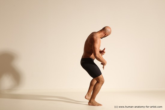 Underwear Gymnastic poses Man Black Muscular Bald Dancing Dynamic poses Academic