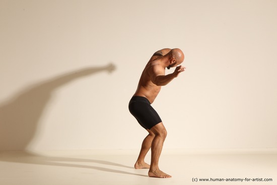 Underwear Gymnastic poses Man Black Muscular Bald Dancing Dynamic poses Academic