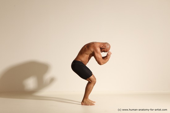 Underwear Gymnastic poses Man Black Muscular Bald Dancing Dynamic poses Academic