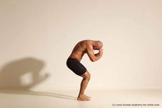 Underwear Gymnastic poses Man Black Muscular Bald Dancing Dynamic poses Academic