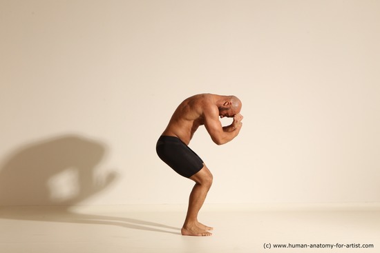 Underwear Gymnastic poses Man Black Muscular Bald Dancing Dynamic poses Academic