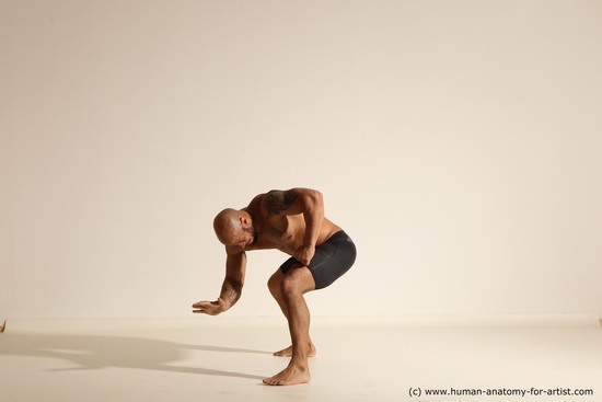 Underwear Gymnastic poses Man Black Muscular Bald Dancing Dynamic poses Academic