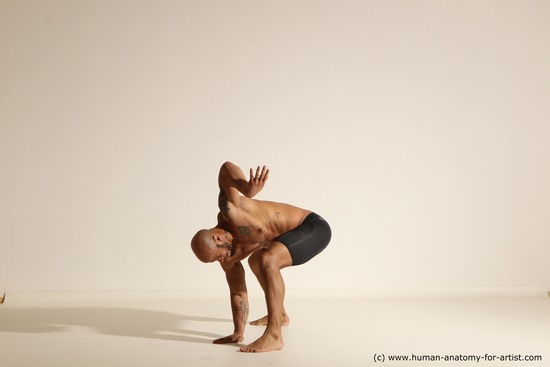 Underwear Gymnastic poses Man Black Muscular Bald Dancing Dynamic poses Academic