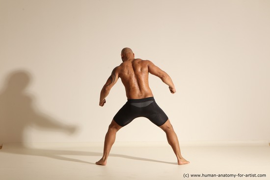 Underwear Gymnastic poses Man Black Muscular Bald Dancing Dynamic poses Academic