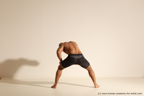 Underwear Gymnastic poses Man Black Muscular Bald Dancing Dynamic poses Academic