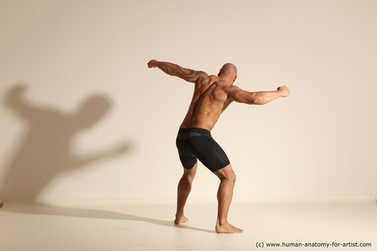 Underwear Gymnastic poses Man Black Muscular Bald Dancing Dynamic poses Academic