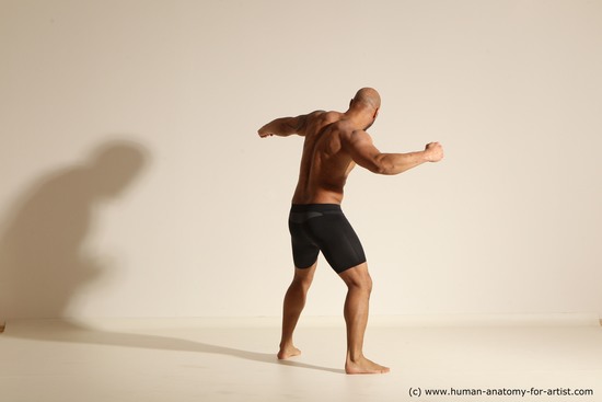 Underwear Gymnastic poses Man Black Muscular Bald Dancing Dynamic poses Academic