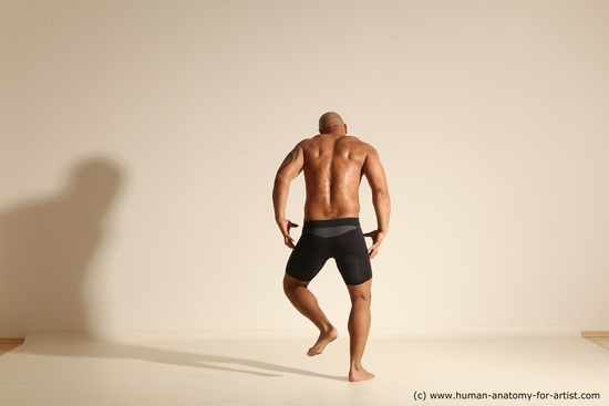 Underwear Gymnastic poses Man Black Muscular Bald Dancing Dynamic poses Academic