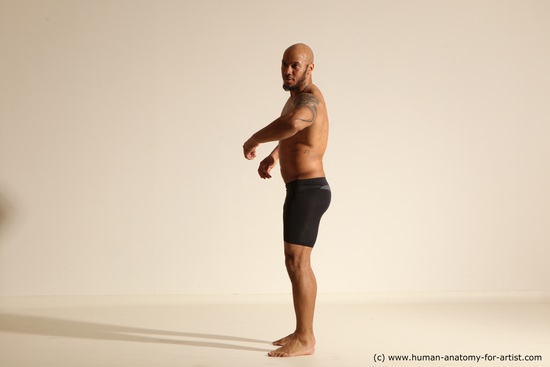 Underwear Gymnastic poses Man Black Muscular Bald Dancing Dynamic poses Academic