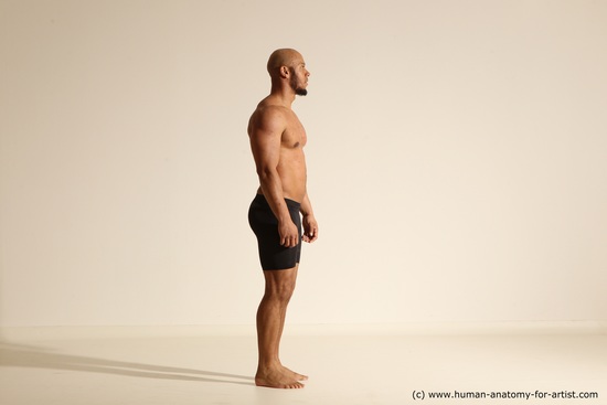 Underwear Gymnastic poses Man Black Muscular Bald Dancing Dynamic poses Academic