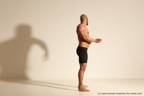 Underwear Gymnastic poses Man Black Muscular Bald Dancing Dynamic poses Academic