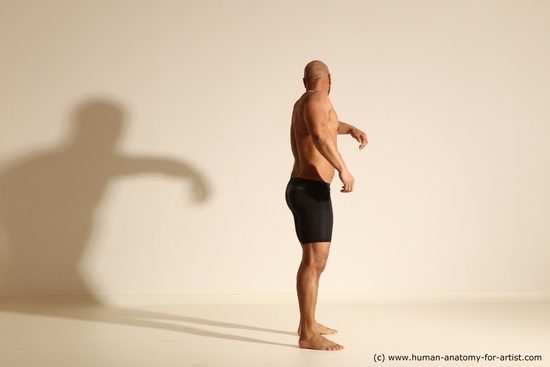 Underwear Gymnastic poses Man Black Muscular Bald Dancing Dynamic poses Academic