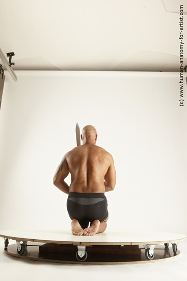 Underwear Fighting with sword Man Black Muscular Bald Multi angles poses Academic