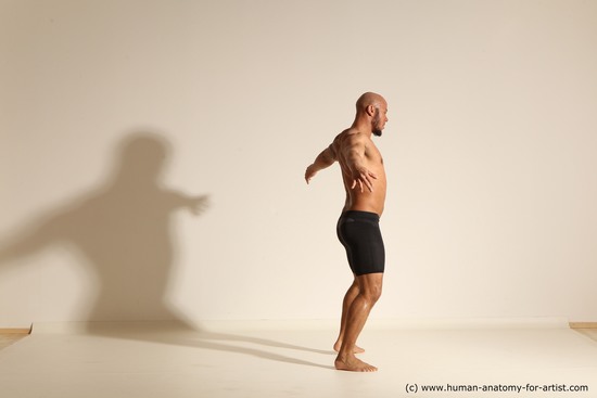 Underwear Man Black Muscular Bald Dynamic poses Academic