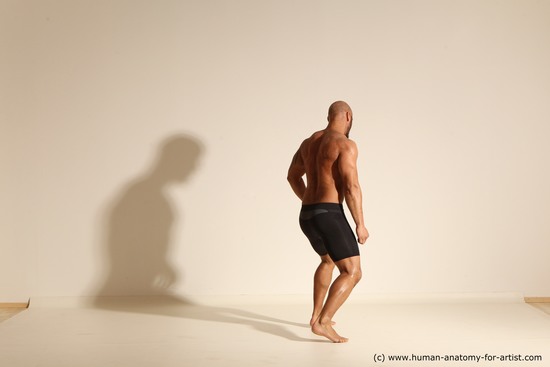 Underwear Man Black Muscular Bald Dynamic poses Academic