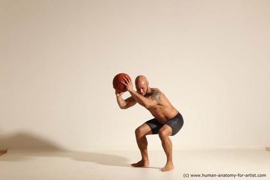 Underwear Man Black Muscular Bald Dynamic poses Academic