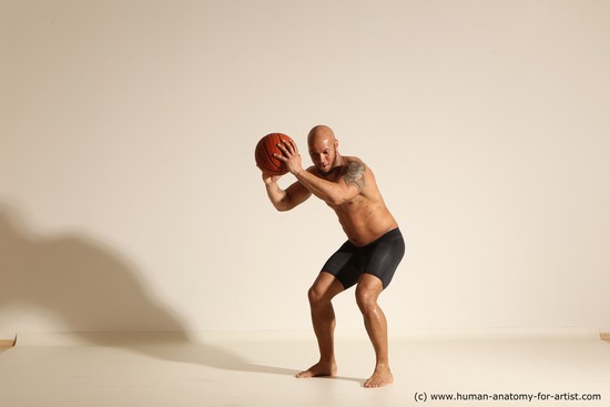 Underwear Man Black Muscular Bald Dynamic poses Academic