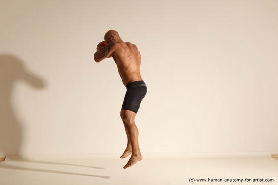 Underwear Man Black Muscular Bald Dynamic poses Academic