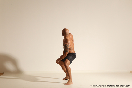 Underwear Man Black Muscular Bald Dynamic poses Academic