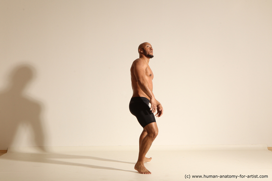 Underwear Man Black Muscular Bald Dynamic poses Academic