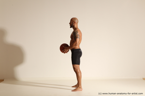 Underwear Man Black Muscular Bald Dynamic poses Academic