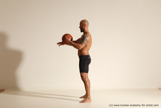 Underwear Man Black Muscular Bald Dynamic poses Academic