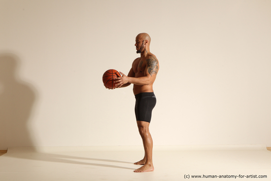 Underwear Man Black Muscular Bald Dynamic poses Academic