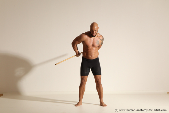 Sportswear Man Black Muscular Bald Dynamic poses Academic