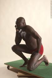 Underwear Man Black Kneeling poses - ALL Average Bald Kneeling poses - on one knee Academic