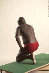 Underwear Man Black Kneeling poses - ALL Average Bald Kneeling poses - on one knee Academic