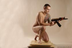 Nude Fighting with spear Man White Kneeling poses - ALL Average Short Brown Kneeling poses - on one knee Realistic