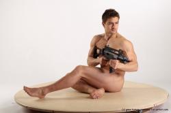 Nude Fighting with submachine gun Man White Sitting poses - simple Muscular Short Brown Sitting poses - ALL Realistic