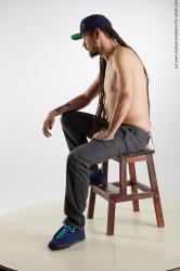 Casual Man White Sitting poses - simple Slim Brown Sitting poses - ALL Dreadlocks Standard Photoshoot Academic