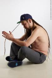Casual Man White Sitting poses - simple Average Brown Sitting poses - ALL Dreadlocks Standard Photoshoot Academic